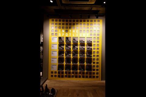 Interior of Dr Martens, Oxford Street, showing footwear on display with a sign saying 'In the spotlight'